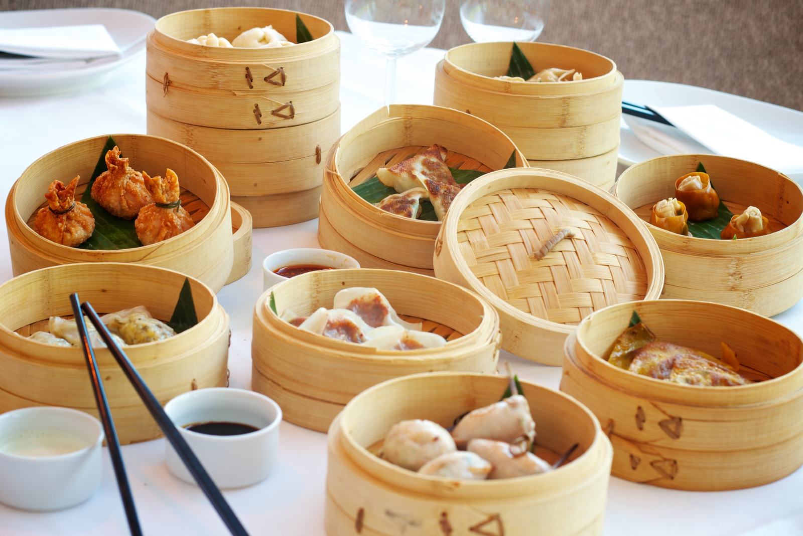 Steamer baskets of dumplings and dim sum on a table at Neptune Seafood Restaurant